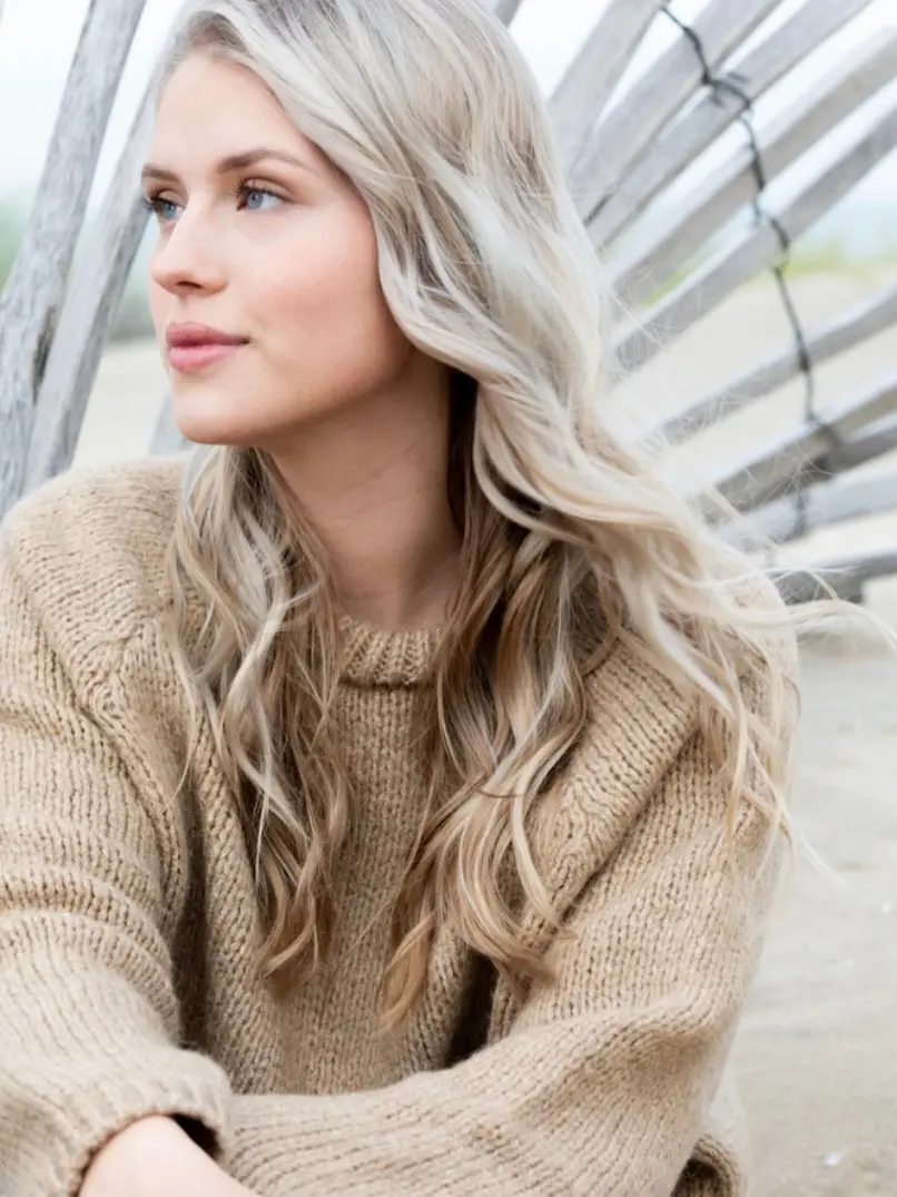 Grey softly blended through blonde lengths, with no hard regrowth line